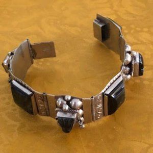 Unusual Stamped Silve Linked Bracelet features six jet stones framed in silver